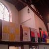 Church decorated with quilts made by Bethlehem's Quilting Club, which were donated to Lutheran World Relief 